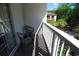 Balcony with two chairs and a view of lush greenery and the building next door at 400 Lands End Blvd. # 5304, Myrtle Beach, SC 29572
