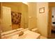Well-lit bathroom featuring single vanity, mirror, toilet, and tiled shower with curtain at 400 Lands End Blvd. # 5304, Myrtle Beach, SC 29572