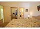Tastefully decorated bedroom features paisley comforter, access to bathroom, and doorway to closet at 400 Lands End Blvd. # 5304, Myrtle Beach, SC 29572