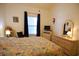 Charming bedroom with vaulted ceiling, colorful paisley bedding, dresser, and sunny window at 400 Lands End Blvd. # 5304, Myrtle Beach, SC 29572