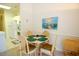 Bright dining area adjacent to the kitchen with a charming table set and a beach-themed painting at 400 Lands End Blvd. # 5304, Myrtle Beach, SC 29572