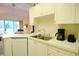 Bright kitchen features white cabinets, stainless sink, modern appliances, and an open design to the living area at 400 Lands End Blvd. # 5304, Myrtle Beach, SC 29572