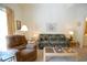 Cozy living room with a plush recliner, a patterned sofa, and a sliding glass door leading to outdoor space at 400 Lands End Blvd. # 5304, Myrtle Beach, SC 29572