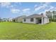 Backyard featuring manicured lawn and view of multiple house elevations at 406 Acosta Circle, Conway, SC 29527