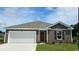 Charming single-story home with a two-car garage and well-manicured lawn at 406 Acosta Circle, Conway, SC 29527
