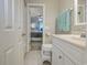 Bathroom features a single sink vanity and tile floors with bedroom access at 415 Ocean Creek Dr. # 2189, Myrtle Beach, SC 29572