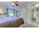 This bedroom has a neutral color scheme, ceiling fan, and carpeted flooring at 415 Ocean Creek Dr. # 2189, Myrtle Beach, SC 29572