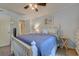 Bedroom with plush carpeting, ceiling fan, soft lighting, and ensuite bathroom access at 415 Ocean Creek Dr. # 2189, Myrtle Beach, SC 29572