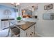 Charming dining area, adjacent to the kitchen, featuring a stylish island and cabinets for modern living and easy entertaining at 415 Ocean Creek Dr. # 2189, Myrtle Beach, SC 29572