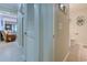 Hallway has tile flooring, half bath, and access to the living room and bedroom at 415 Ocean Creek Dr. # 2189, Myrtle Beach, SC 29572
