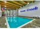 Spacious indoor pool area with ample natural light and comfortable seating, perfect for year-round enjoyment at 415 Ocean Creek Dr. # 2189, Myrtle Beach, SC 29572