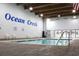 Inviting indoor pool area with brick pavers and ample seating at 415 Ocean Creek Dr. # 2189, Myrtle Beach, SC 29572