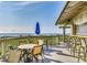 Relax on the ocean view deck with seating and a covered outdoor bar area at 415 Ocean Creek Dr. # 2189, Myrtle Beach, SC 29572