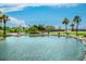 Picturesque view of a pond and palm trees at 415 Ocean Creek Dr. # 2189, Myrtle Beach, SC 29572