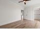 Bedroom featuring wood-look floors, ceiling fan, and walk-in closet at 434 Harbour View Dr., Myrtle Beach, SC 29579