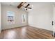 Bright bedroom with hardwood flooring, tray ceilings, wood beams, and natural light at 434 Harbour View Dr., Myrtle Beach, SC 29579