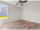 Bedroom with wood-look floors and large window at 434 Harbour View Dr., Myrtle Beach, SC 29579
