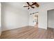 Bright bedroom with hardwood flooring, barn door, tray ceilings, and natural light at 434 Harbour View Dr., Myrtle Beach, SC 29579
