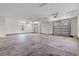Spacious three car garage with concrete floors, ample lighting, and two garage doors at 434 Harbour View Dr., Myrtle Beach, SC 29579