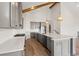 Modern kitchen with quartz countertops, stainless steel appliances, and gray cabinets at 434 Harbour View Dr., Myrtle Beach, SC 29579