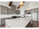 Spacious kitchen featuring a large island with quartz countertop, stainless steel appliances, and gray cabinets at 434 Harbour View Dr., Myrtle Beach, SC 29579