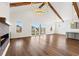 Spacious living room with wood floors, vaulted ceiling, fireplace, and access to the outside at 434 Harbour View Dr., Myrtle Beach, SC 29579