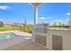 Outdoor kitchen area featuring stainless steel grill and granite countertops at 434 Harbour View Dr., Myrtle Beach, SC 29579
