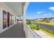 Spacious outdoor patio overlooking a serene waterway and lush green lawns under a clear blue sky at 434 Harbour View Dr., Myrtle Beach, SC 29579