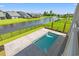 Backyard pool with a view of the adjacent pond at 434 Harbour View Dr., Myrtle Beach, SC 29579