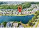 Showcasing the desirable community layout with homes surrounding a peaceful lake at 4548 Marshwood Dr., Myrtle Beach, SC 29579