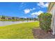 Backyard showing the well manicured lawn and serene pond views at 4548 Marshwood Dr., Myrtle Beach, SC 29579