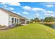 Lovely backyard and exterior showing the pond view from the screened porch at 4548 Marshwood Dr., Myrtle Beach, SC 29579