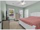 Cozy bedroom with natural light, ceiling fan and neutral decor at 4548 Marshwood Dr., Myrtle Beach, SC 29579