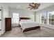 Inviting bedroom with a ceiling fan, carpet, and two windows providing natural light at 4548 Marshwood Dr., Myrtle Beach, SC 29579