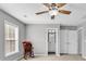 Bright bonus room with ceiling fan, rocking chair and two windows at 4548 Marshwood Dr., Myrtle Beach, SC 29579