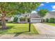 Charming single-story home featuring a well-manicured lawn, inviting porch, and attached two-car garage at 4548 Marshwood Dr., Myrtle Beach, SC 29579
