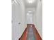 Bright hallway showcasing hardwood floors, white trim, and an arched entrance at 4548 Marshwood Dr., Myrtle Beach, SC 29579