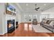 Cozy living room with a fireplace, hardwood floors, and plenty of natural light at 4548 Marshwood Dr., Myrtle Beach, SC 29579