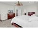 Cozy bedroom featuring a ceiling fan, with a dresser and soft carpet flooring at 4548 Marshwood Dr., Myrtle Beach, SC 29579