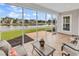 Inviting screened porch providing tranquil pond views and comfortable seating at 4548 Marshwood Dr., Myrtle Beach, SC 29579