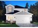Charming two-story home showcasing a symmetrical design with a two-car garage and tasteful stone accents at 4845 Hopespring St., Myrtle Beach, SC 29579