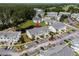 Aerial view showcases the community's well-maintained landscaping, parking, and pond with a marker for navigation at 4933 Crab Pond Ct. # 201, Myrtle Beach, SC 29579