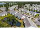 Community aerial view shows pond views from the building with an arrow marker for unit location at 4933 Crab Pond Ct. # 201, Myrtle Beach, SC 29579
