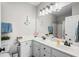 Inviting bathroom with double sinks, stylish mirror, and charming nautical-themed décor, offering comfort and functionality at 4933 Crab Pond Ct. # 201, Myrtle Beach, SC 29579