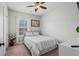 Cozy bedroom featuring a full-sized bed, a bright window, and fresh decor, creating a warm inviting space at 4933 Crab Pond Ct. # 201, Myrtle Beach, SC 29579