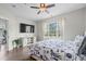 Serene main bedroom with large window, ceiling fan, and stylish décor, offering a relaxing retreat at 4933 Crab Pond Ct. # 201, Myrtle Beach, SC 29579