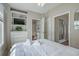 Bedroom showcasing built-in shelving, a ceiling fan, bedside tables, and access to en-suite bath at 500 23Rd Ave. S, North Myrtle Beach, SC 29582