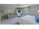 Bedroom with queen bed, TV, ceiling fan, and a large window looking out onto the street at 500 23Rd Ave. S, North Myrtle Beach, SC 29582