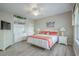 Bedroom features built-in shelving, a ceiling fan, bedside tables, and wood-look flooring at 500 23Rd Ave. S, North Myrtle Beach, SC 29582