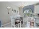 Elegant dining area with a large table, chair set, and abundant natural light at 500 23Rd Ave. S, North Myrtle Beach, SC 29582